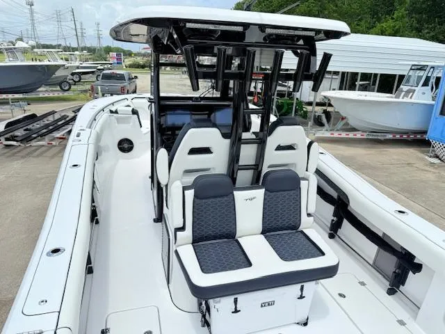 Slide: The Image of 2026 Tidewater 302 CC Adventure boat with dual seating and modern console design. - 4