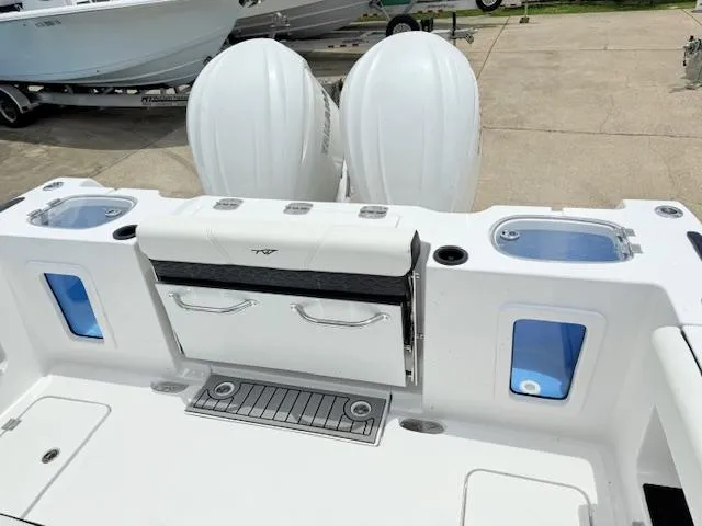 Slide: The Image of 2026 Tidewater 302 CC Adventure boat with dual outboard motors and fishing station. - 5