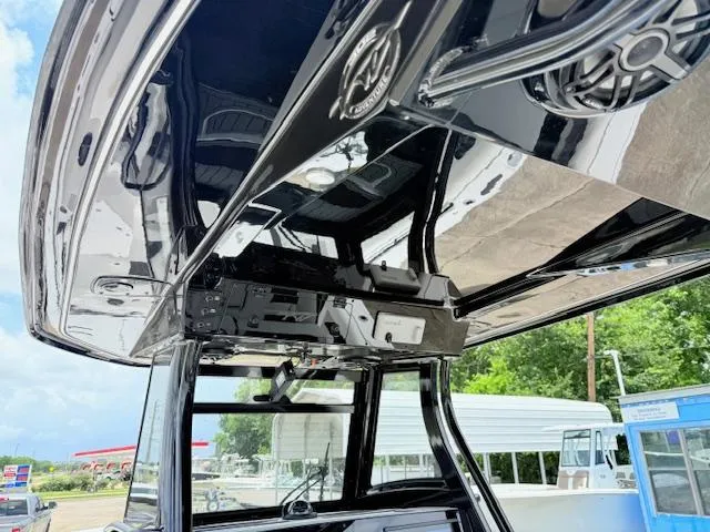 Slide: The Image of Tidewater 302 CC Adventure 2026 boat interior with sleek black design and modern features. - 7