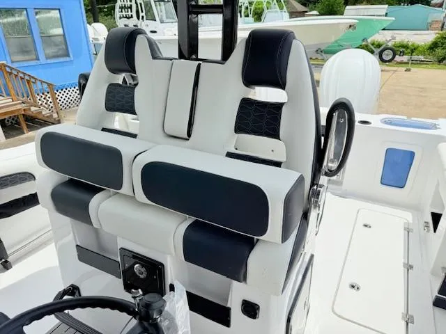 Slide: The Image of 2026 Tidewater 302 CC Adventure boat interior with modern seating and steering wheel. - 9