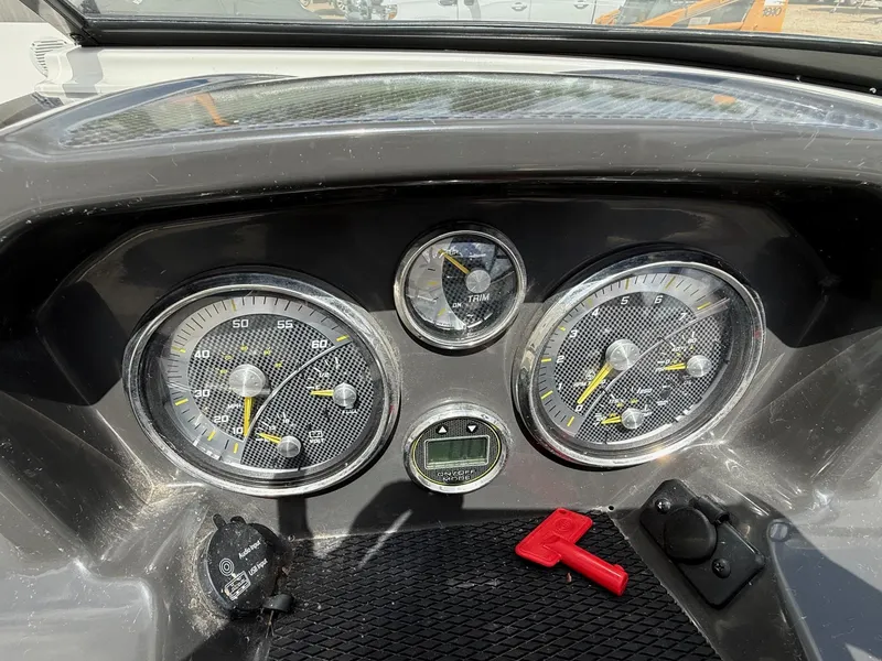 Slide: The Image of Dashboard of a 2021 Bayliner VR5 boat with gauges and controls. - 12