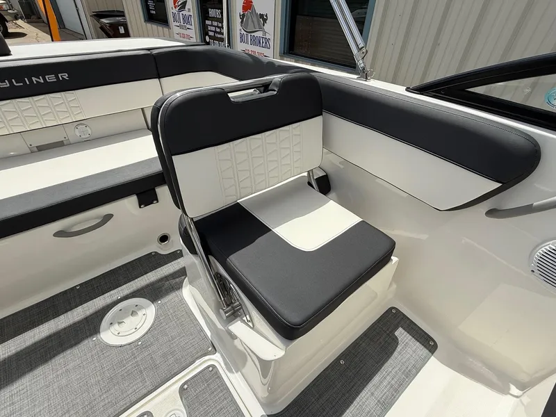 Slide: The Image of 2021 Bayliner VR5 boat interior with black and white seating. - 16
