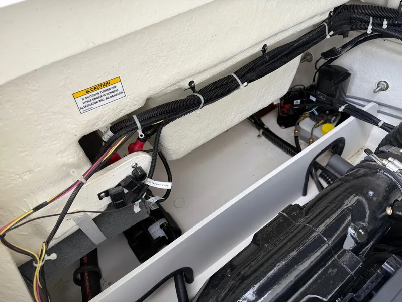 Slide: The Image of Engine compartment of 2021 Bayliner VR5 boat, showing wiring and components. - 23