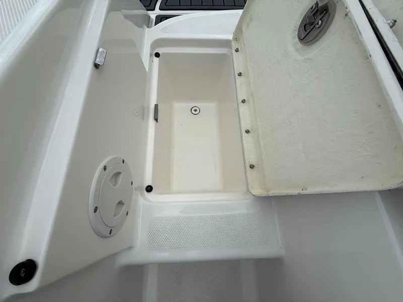 Slide: The Image of Open storage compartment on 2021 Bayliner VR5 boat, showcasing interior details. - 26