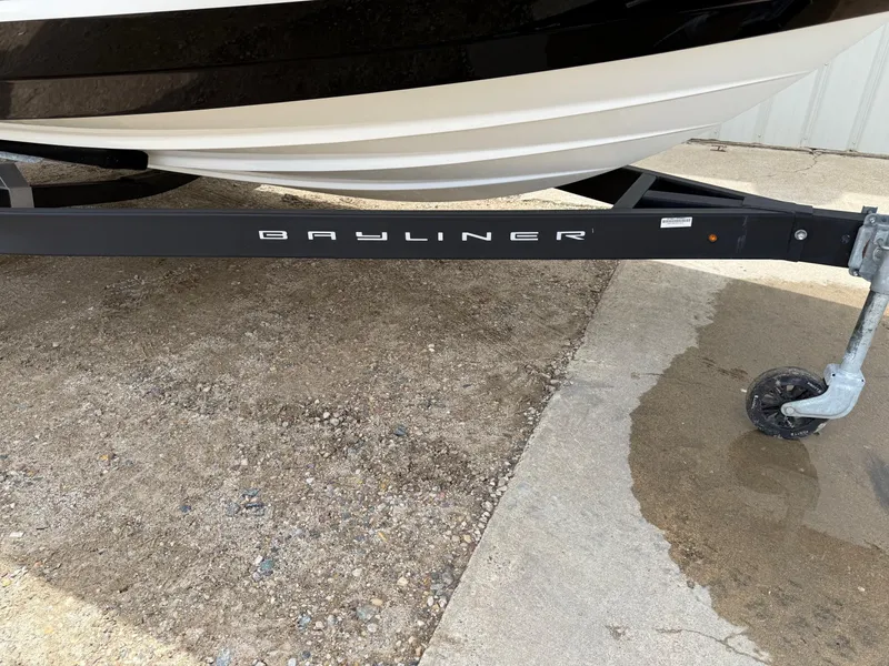 Slide: The Image of 2021 Bayliner VR5 boat on trailer, parked on gravel and concrete surface. - 29