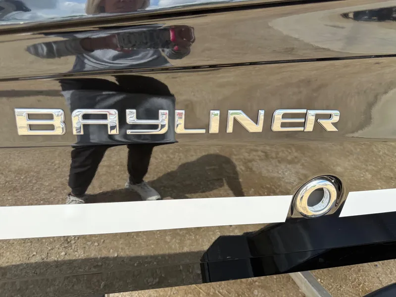 Slide: The Image of 2021 Bayliner VR5 boat with reflective surface and logo. - 3