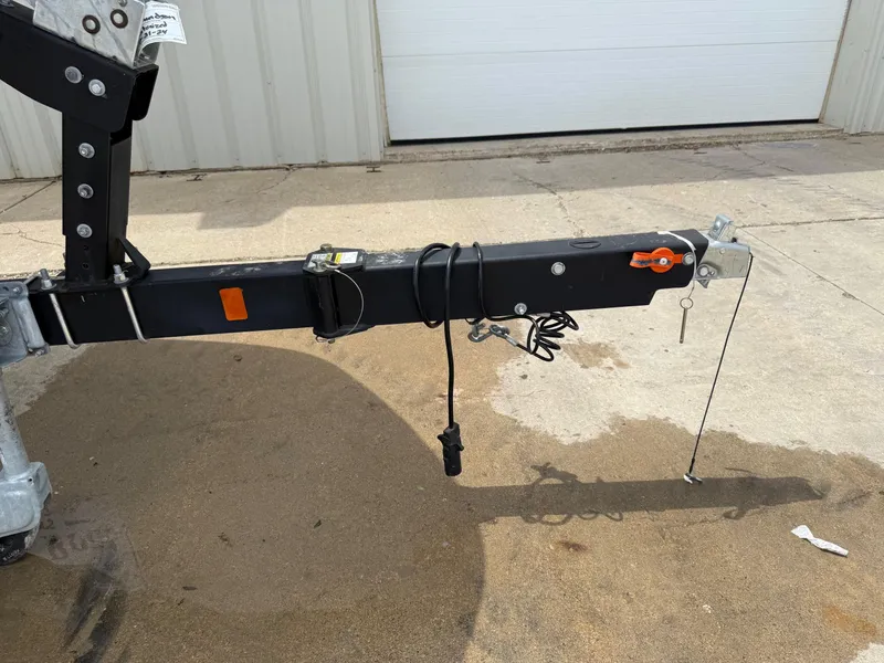 Slide: The Image of Trailer hitch of a 2021 Bayliner VR5 boat on concrete surface. - 30