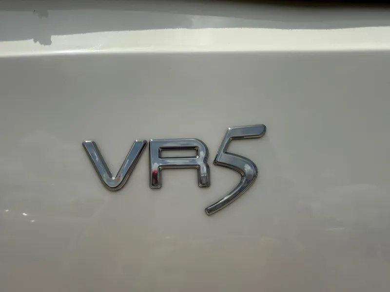 Slide: The Image of 2021 Bayliner VR5 emblem on a white surface. - 4