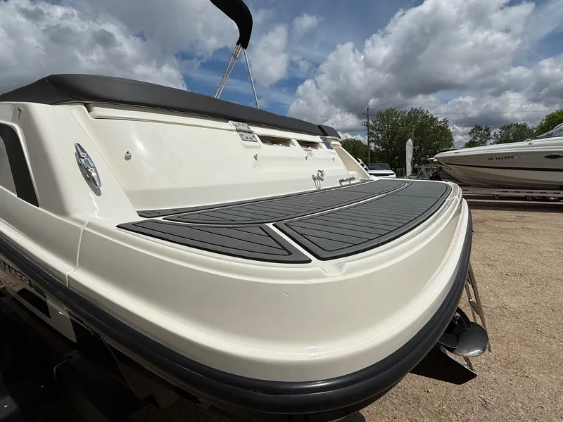 Slide: The Image of 2021 Bayliner VR5 boat rear view with swim platform under cloudy sky. - 7