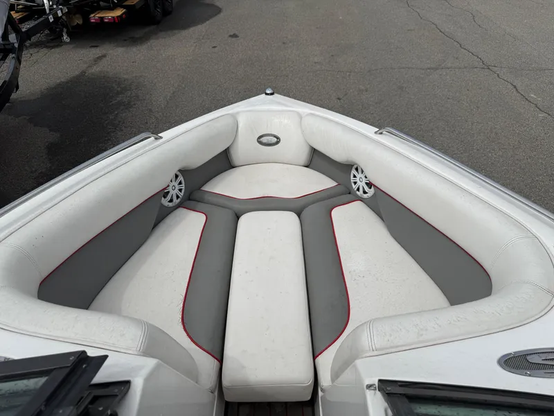Slide: The Image of 2007 Supra Launch 20 SSV boat interior with white and gray seating. - 10