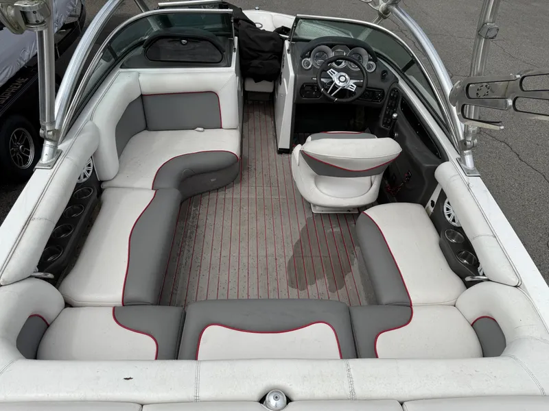 Slide: The Image of 2007 Supra Launch 20 SSV boat interior with gray and white seating, steering wheel, and dashboard. - 11