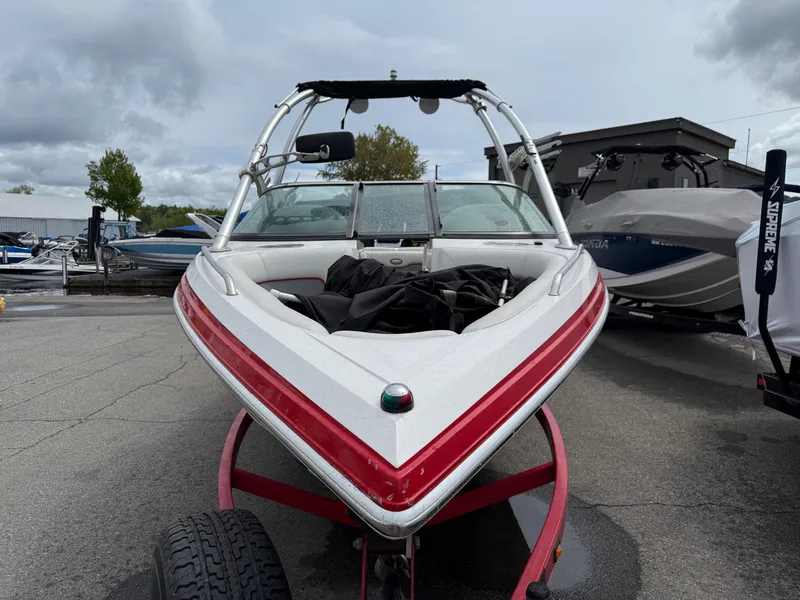 Slide: The Image of 2007 Supra Launch 20 SSV boat on trailer, parked outdoors. - 4