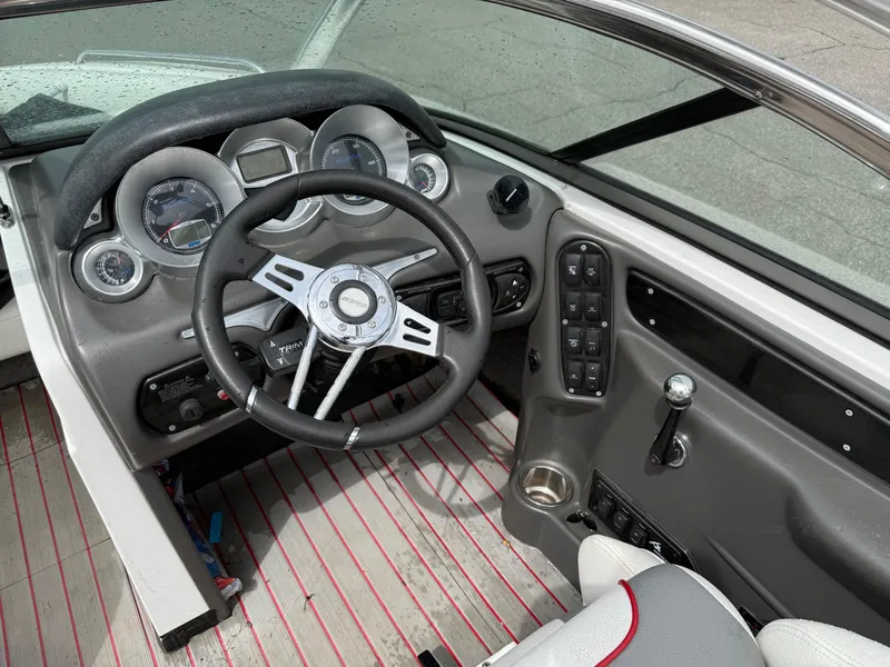 Slide: The Image of 2007 Supra Launch 20 SSV boat dashboard with steering wheel and control panel. - 6