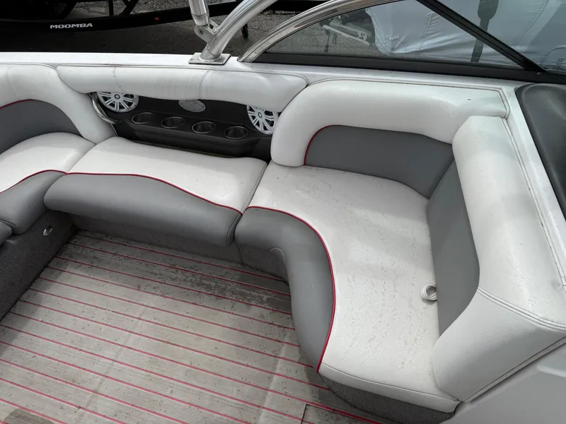 Slide: The Image of 2007 Supra Launch 20 SSV boat interior with gray and white seating, cup holders, and speakers. - 9