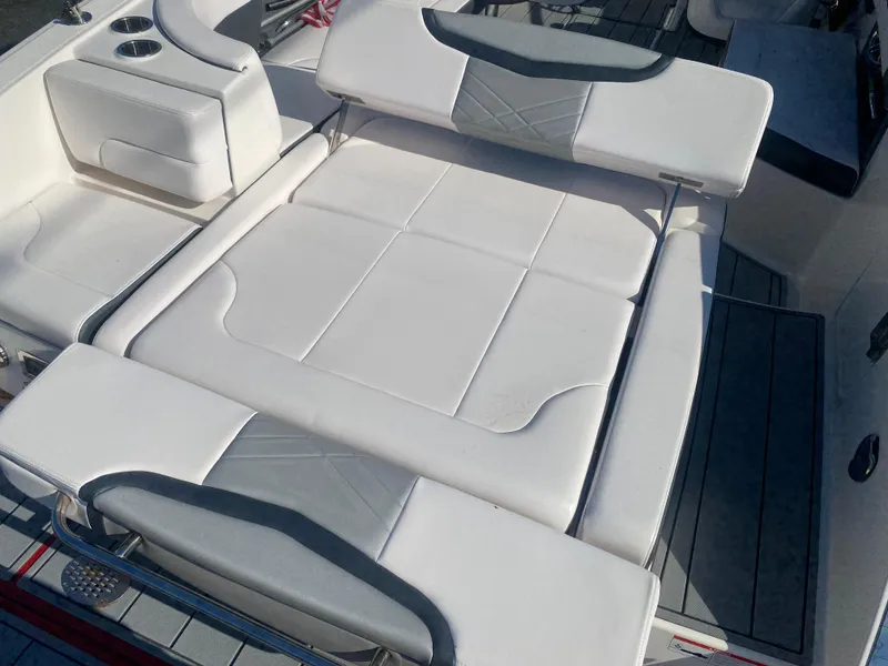 Slide: The Image of 2021 Chaparral 287 SSX boat with spacious white and gray seating area. - 10