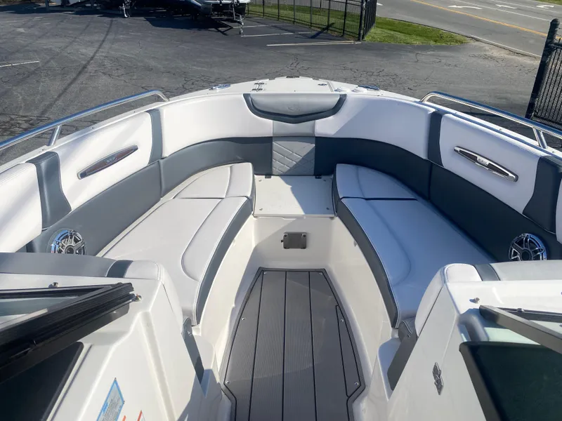 Slide: The Image of 2021 Chaparral 287 SSX boat interior with sleek seating and modern design. - 4