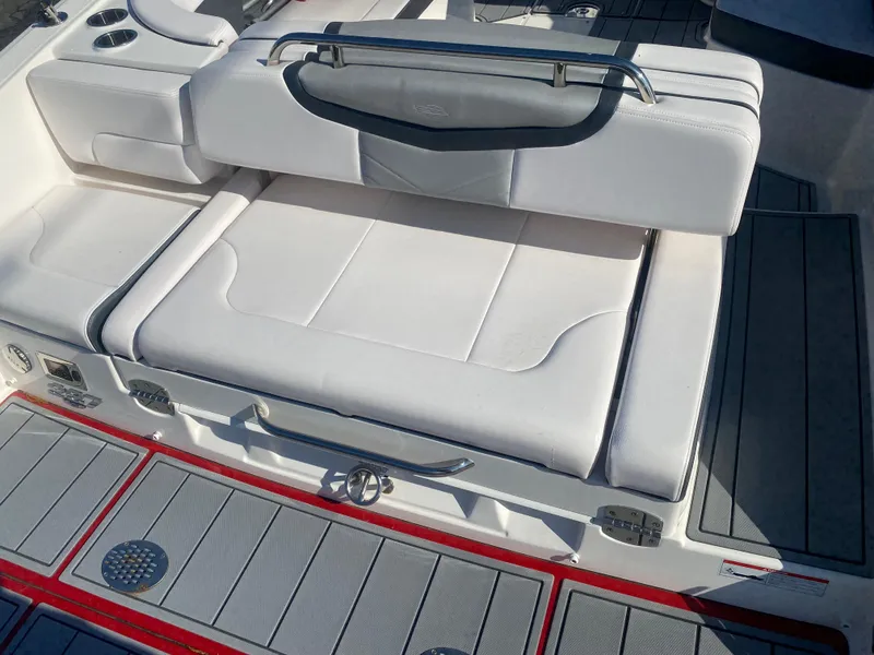 Slide: The Image of 2021 Chaparral 287 SSX boat with white cushioned seating and sleek design. - 9