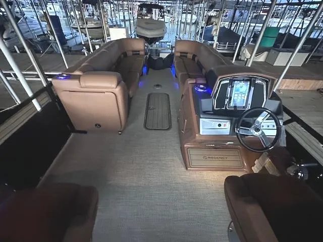Slide: The Image of Interior of 2022 Regency 250 LE3 Sport boat with luxurious seating and modern dashboard. - 15
