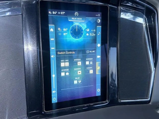 Slide: The Image of Touchscreen control panel in a 2022 Regency 250 LE3 Sport boat, displaying various settings. - 23