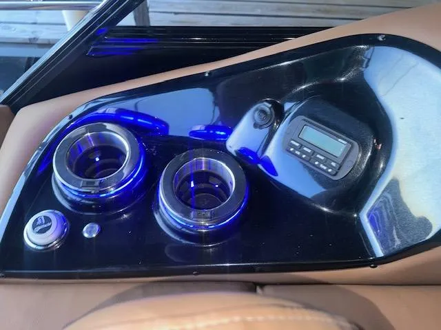 Slide: The Image of Control panel of 2022 Regency 250 LE3 Sport with illuminated cup holders and digital display. - 24