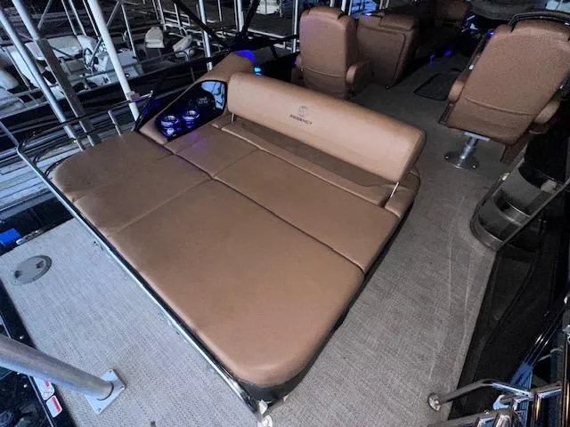 Slide: The Image of 2022 Regency 250 LE3 Sport boat interior with tan seating and modern design. - 25