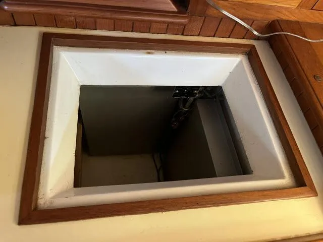 Slide: The Image of Open hatch on 1983 Bluewater Vagabond 47 sailboat, showcasing interior compartment. - 13