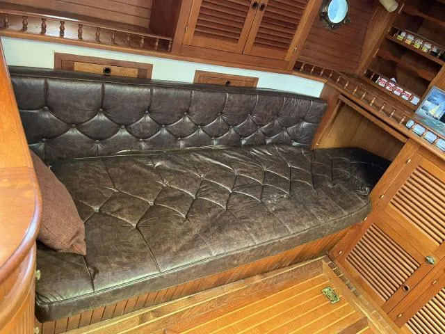 Slide: The Image of Luxurious leather seating in 1983 Bluewater Vagabond 47 yacht interior. - 2