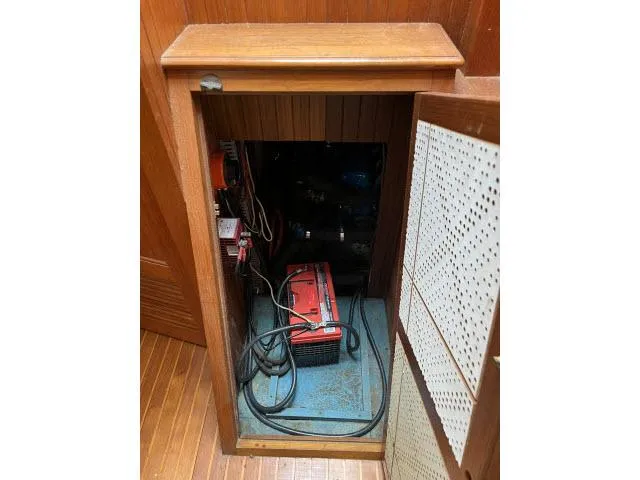 Slide: The Image of Electrical compartment of 1983 Bluewater Vagabond 47 sailboat with battery and wiring. - 20