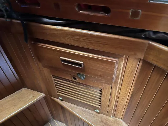 Slide: The Image of Wooden interior cabinetry of a 1983 Bluewater Vagabond 47 sailboat. - 24