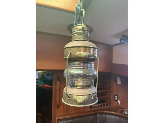Slide: The Image of Vintage lantern inside 1983 Bluewater Vagabond 47 yacht cabin. - 53
