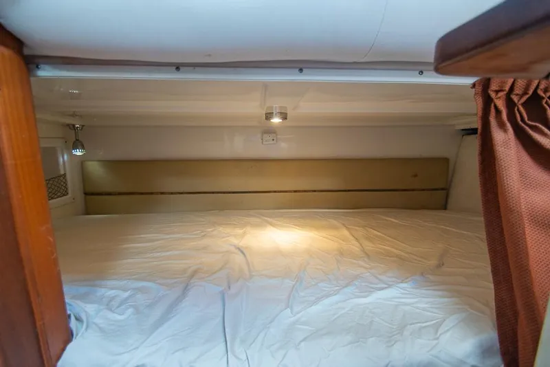 Slide: The Image of 2009 Pro-Line 35 Express cabin interior with bed and lighting. - 18