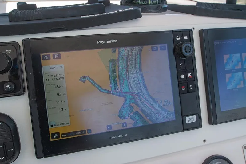 Slide: The Image of Raymarine navigation display on 2009 Pro-Line 35 Express boat, showing detailed marine chart. - 24