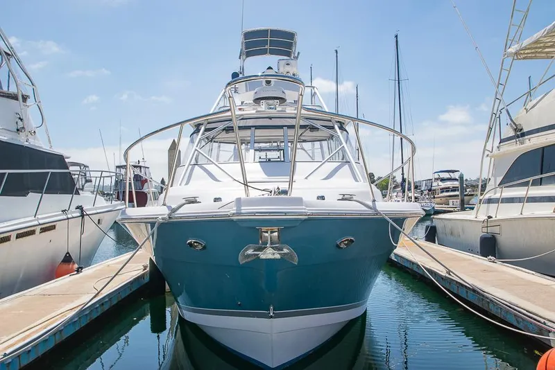 Slide: The Image of 2009 Pro-Line 35 Express boat docked at marina, front view. - 3