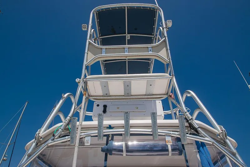 Slide: The Image of 2009 Pro-Line 35 Express boat tower against clear blue sky. - 35