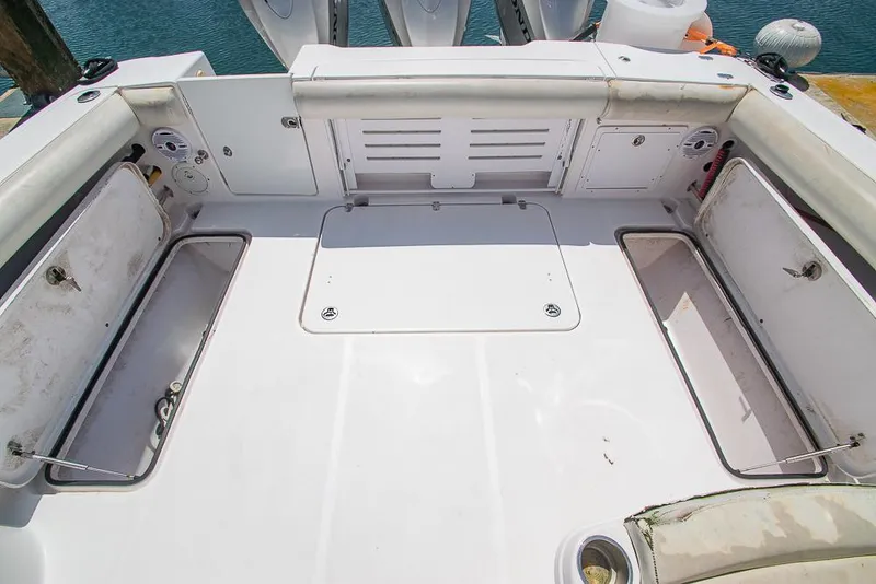Slide: The Image of 2009 Pro-Line 35 Express boat deck with open storage compartments. - 36