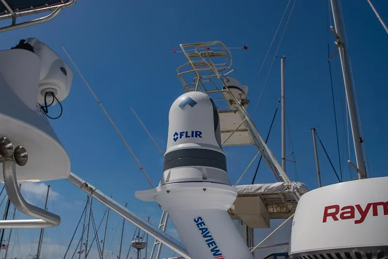 Slide: The Image of 2009 Pro-Line 35 Express boat with FLIR and Raymarine equipment under clear blue sky. - 40