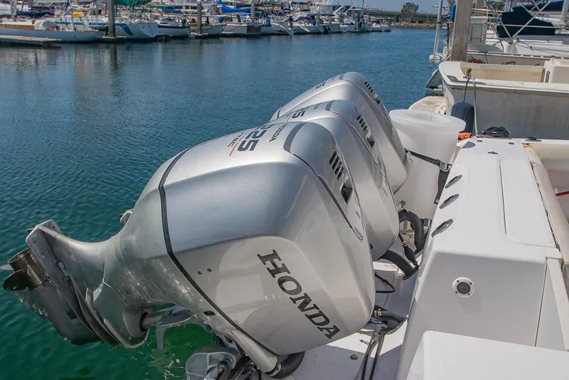 Slide: The Image of 2009 Pro-Line 35 Express with Honda outboard engines docked at marina. - 45