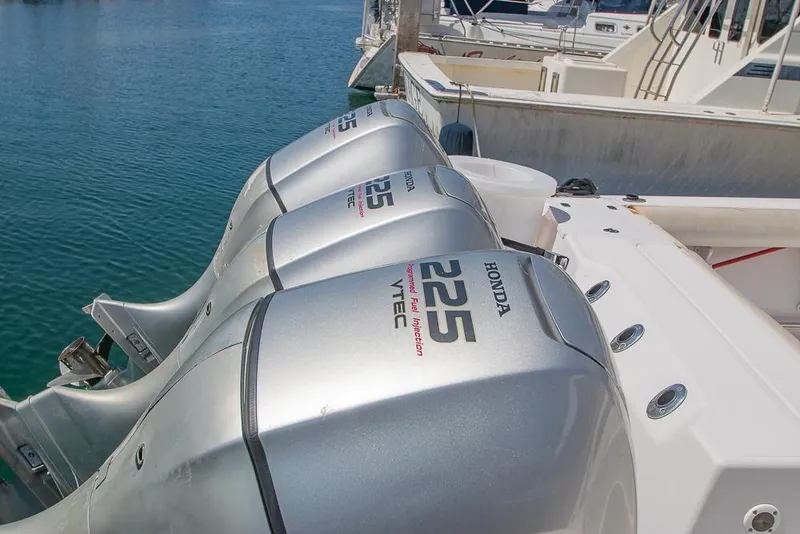 Slide: The Image of Triple Honda 225 VTEC outboard engines on a 2009 Pro-Line 35 Express boat. - 46