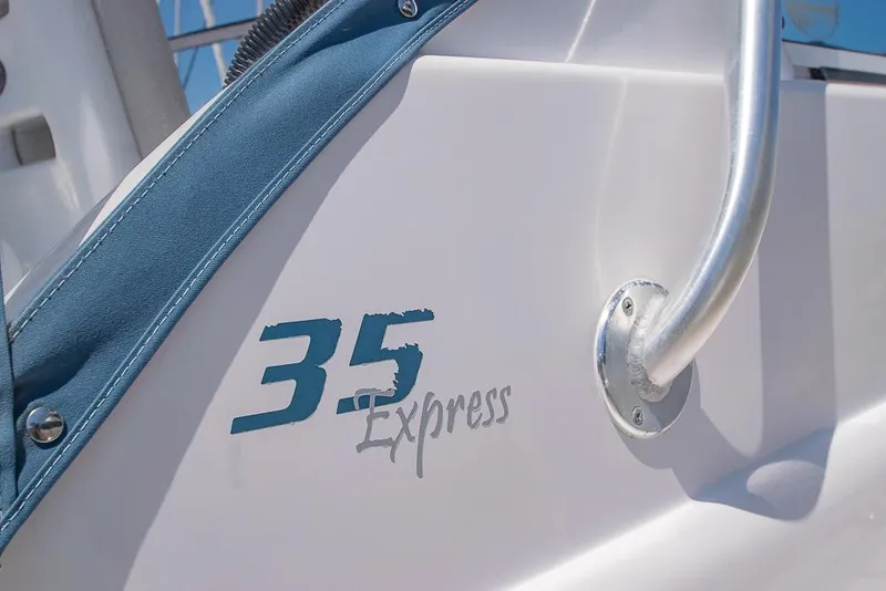 Slide: The Image of 2009 Pro-Line 35 Express boat detail with logo and railing. - 6