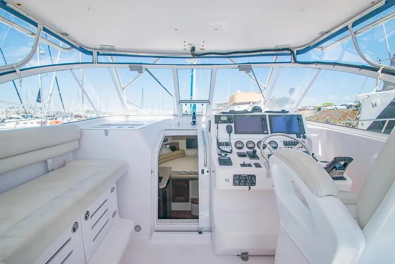 Slide: The Image of 2009 Pro-Line 35 Express boat interior with helm, seating, and navigation equipment. - 9