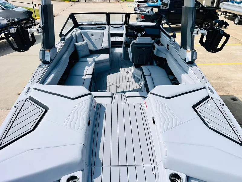 Slide: The Image of 2025 Nautique Super Air G23 boat interior with sleek seating and modern design. - 10