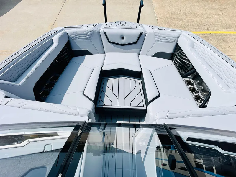 Slide: The Image of 2025 Nautique Super Air G23 boat interior with luxurious seating and modern design. - 11