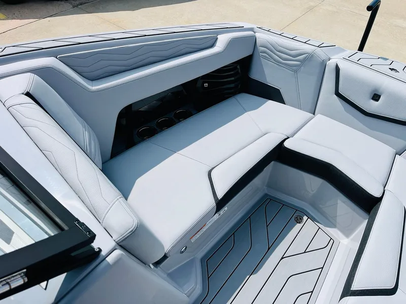 Slide: The Image of 2025 Nautique Super Air G23 interior with sleek, modern seating and stylish design. - 15