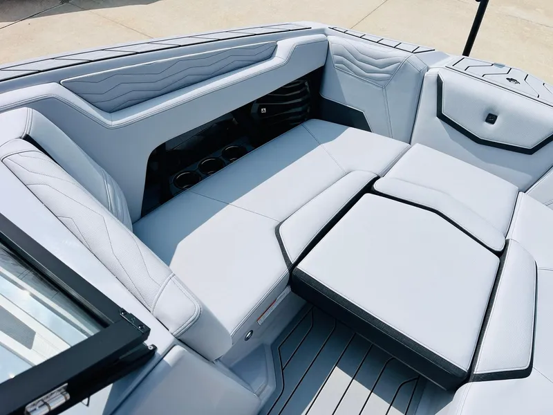 Slide: The Image of 2025 Nautique Super Air G23 boat interior with luxurious seating and modern design. - 18