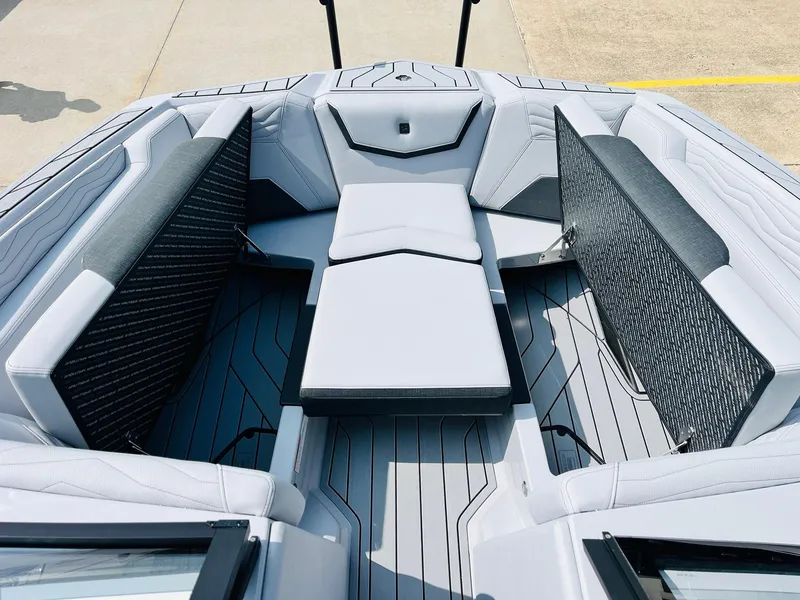 Slide: The Image of 2025 Nautique Super Air G23 boat interior with sleek seating and modern design. - 20