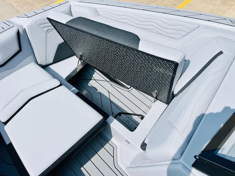 Slide: The Image of 2025 Nautique Super Air G23 boat interior with adjustable seating and sleek design. - 22