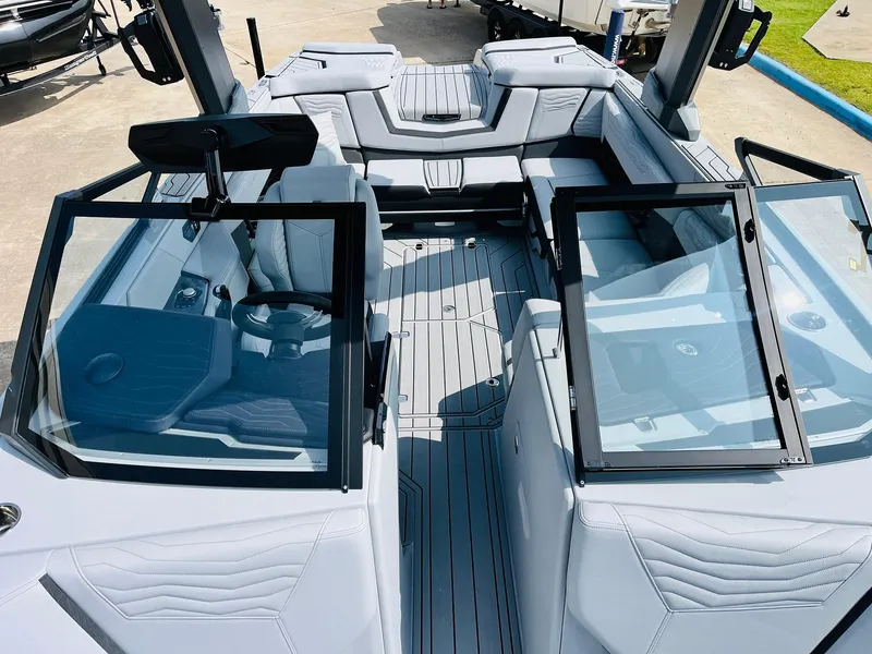 Slide: The Image of 2025 Nautique Super Air G23 boat interior with sleek seating and modern design. - 23