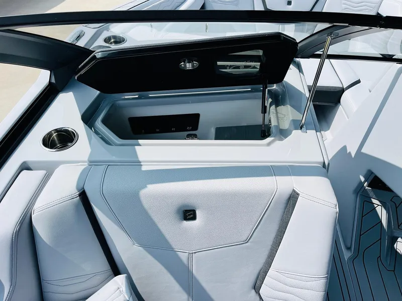 Slide: The Image of 2025 Nautique Super Air G23 boat interior with sleek seating and modern design. - 26