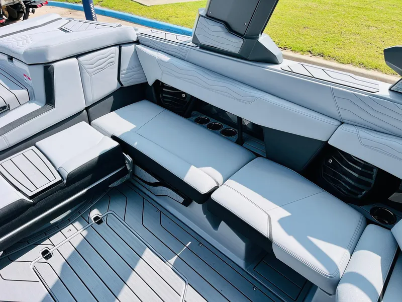 Slide: The Image of 2025 Nautique Super Air G23 boat interior with sleek gray seating and modern design. - 30