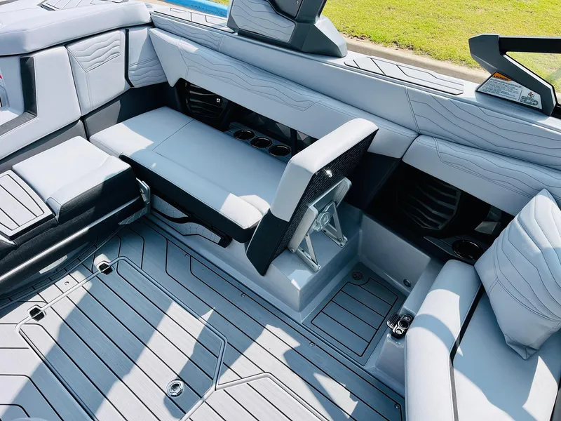 Slide: The Image of 2025 Nautique Super Air G23 interior with sleek seating and modern design. - 31